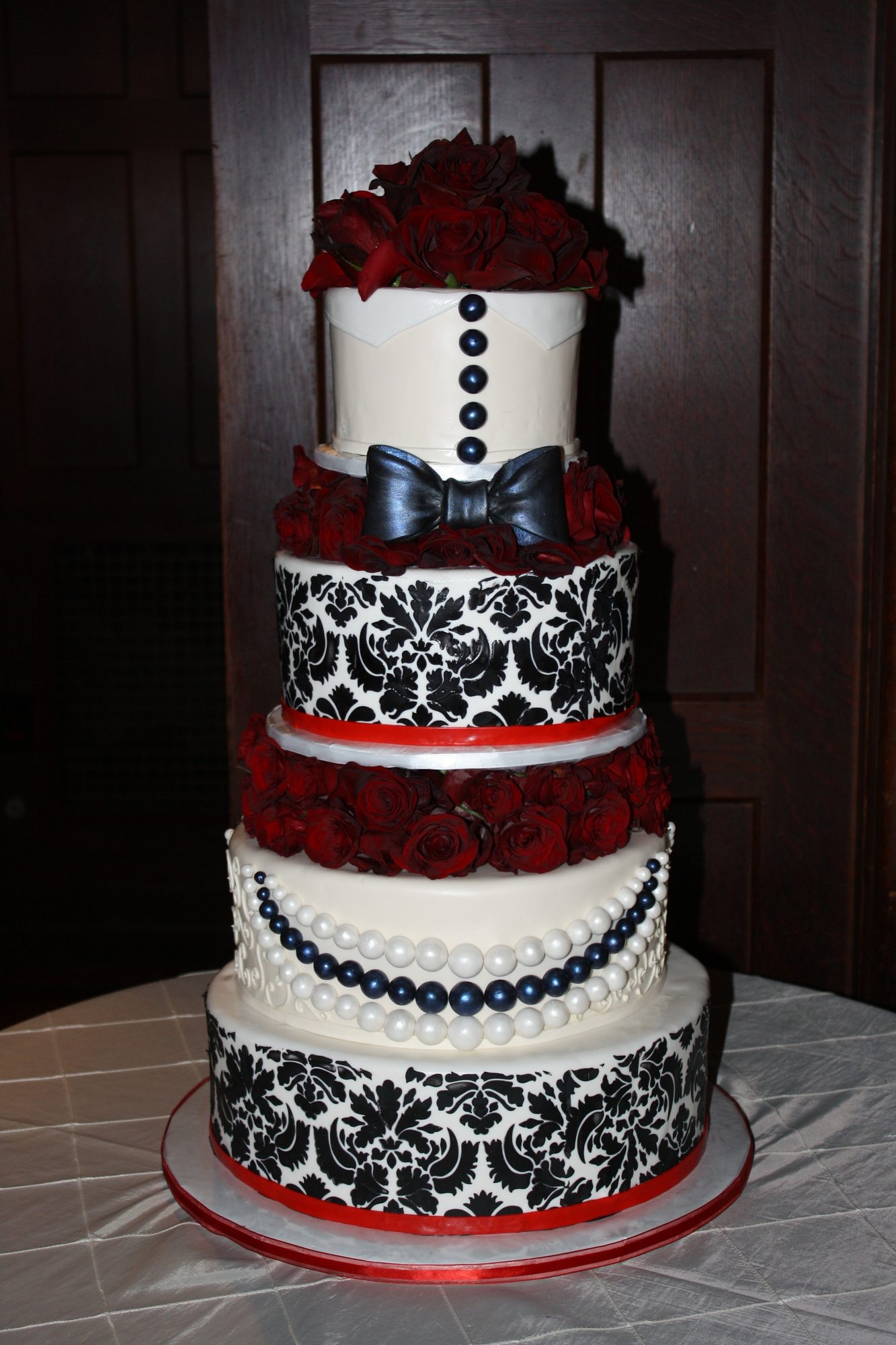 Tuxedo-inspired damask wedding cake with bowtie
