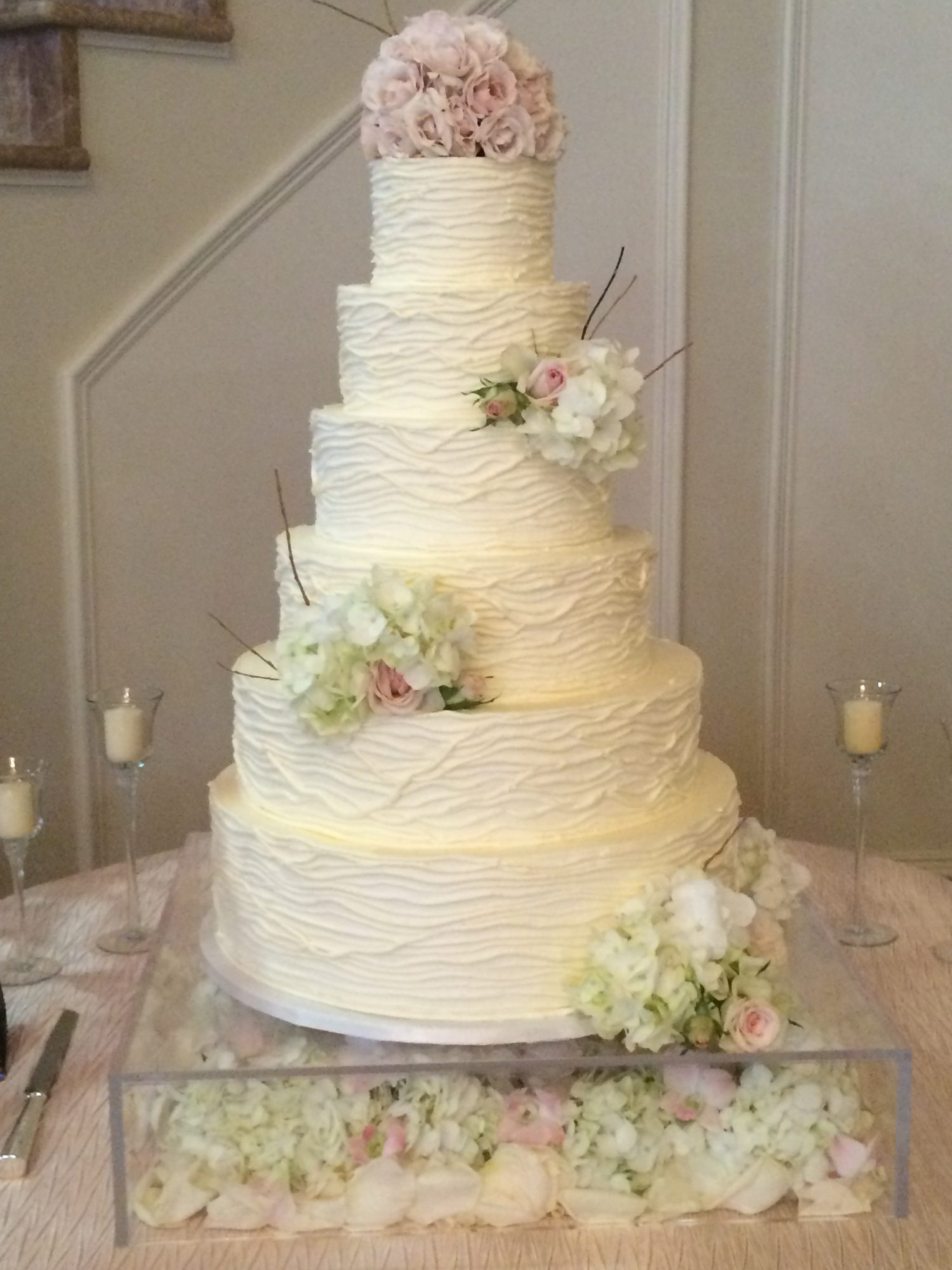 Textured wedding cake with fresh blush flowers