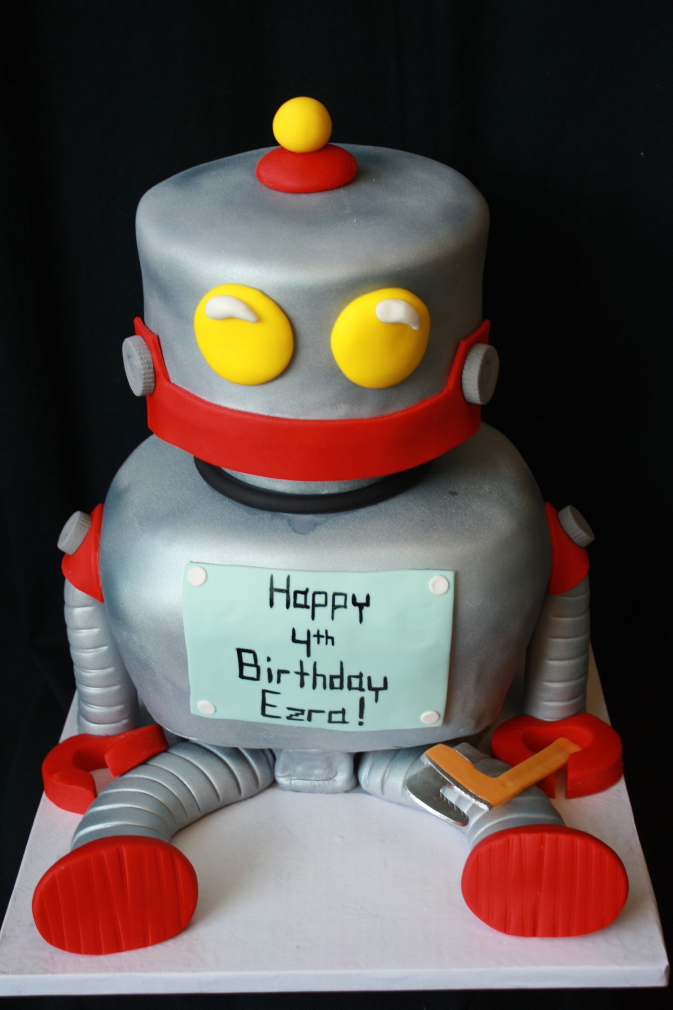 Sculpted retro robot cake